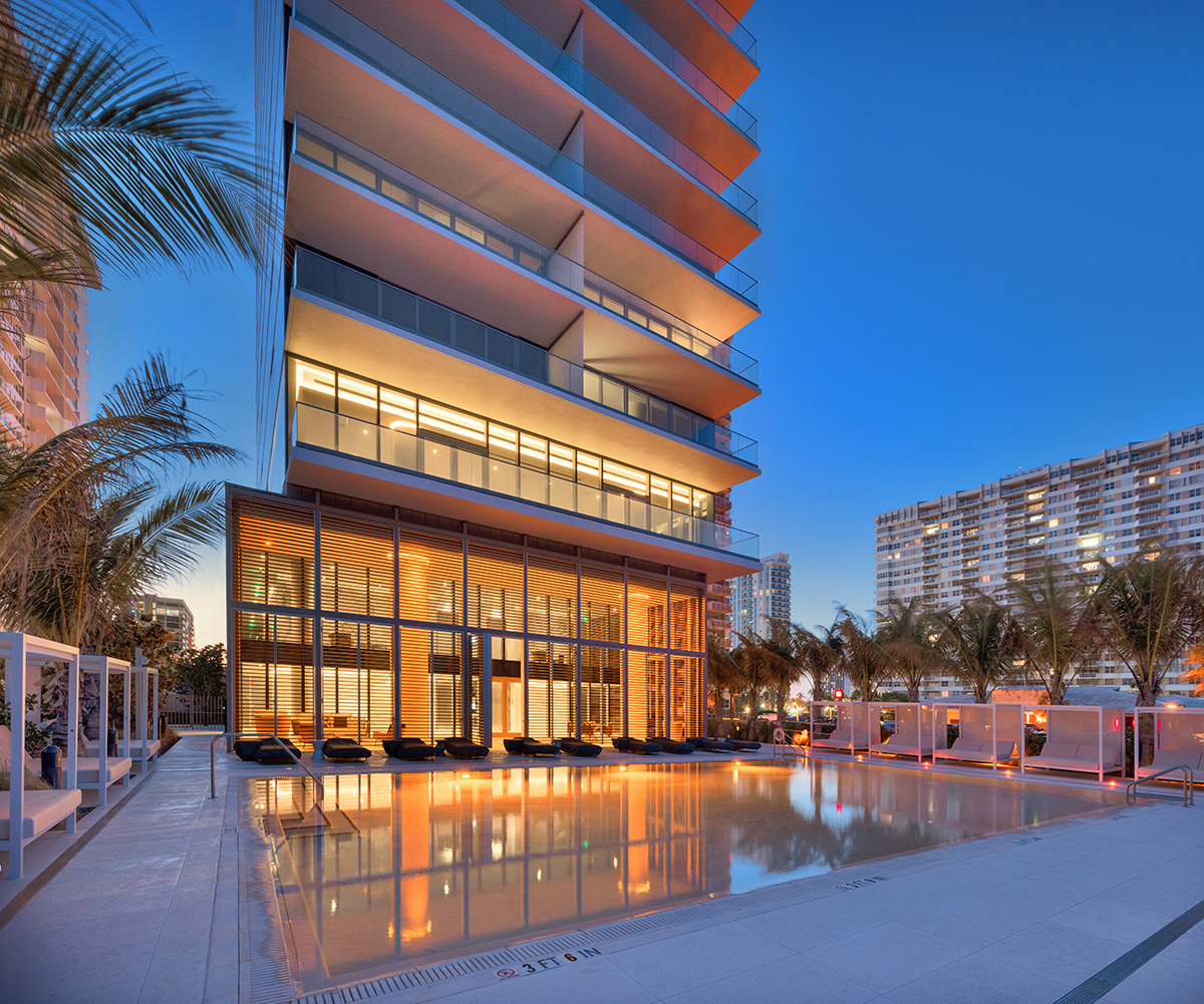 Architectural dusk pool view at the 2000 Ocean condo in Hallandale Beach, FL.
