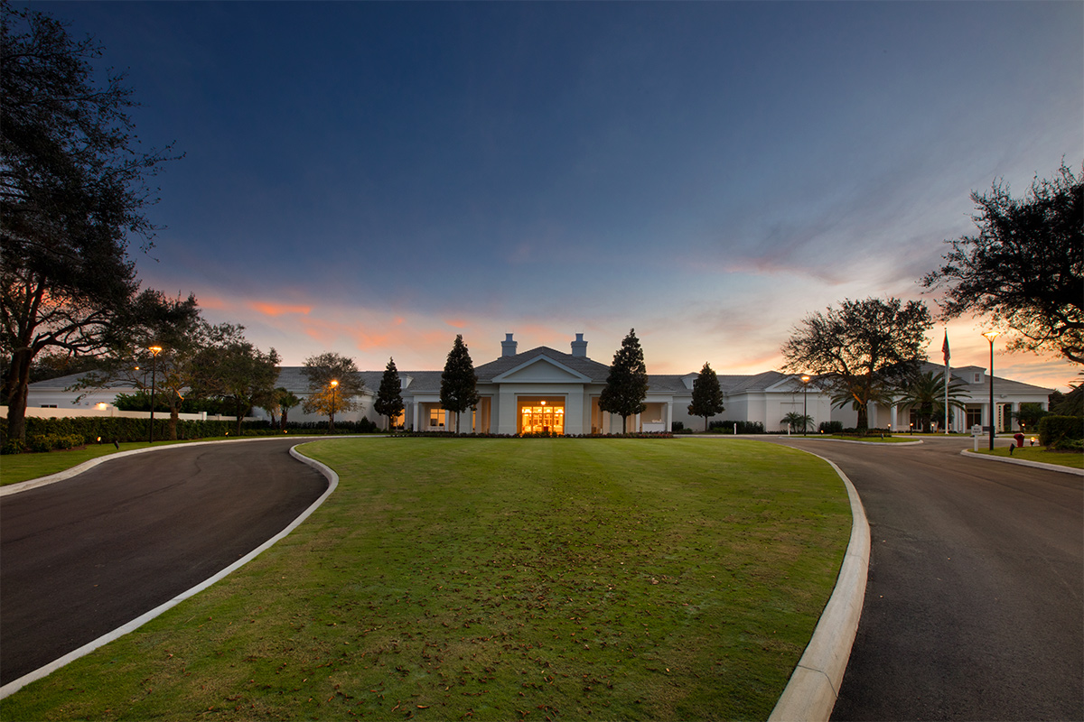 High Ridge Country Club Boynton Beach clubhouse view at dusk.