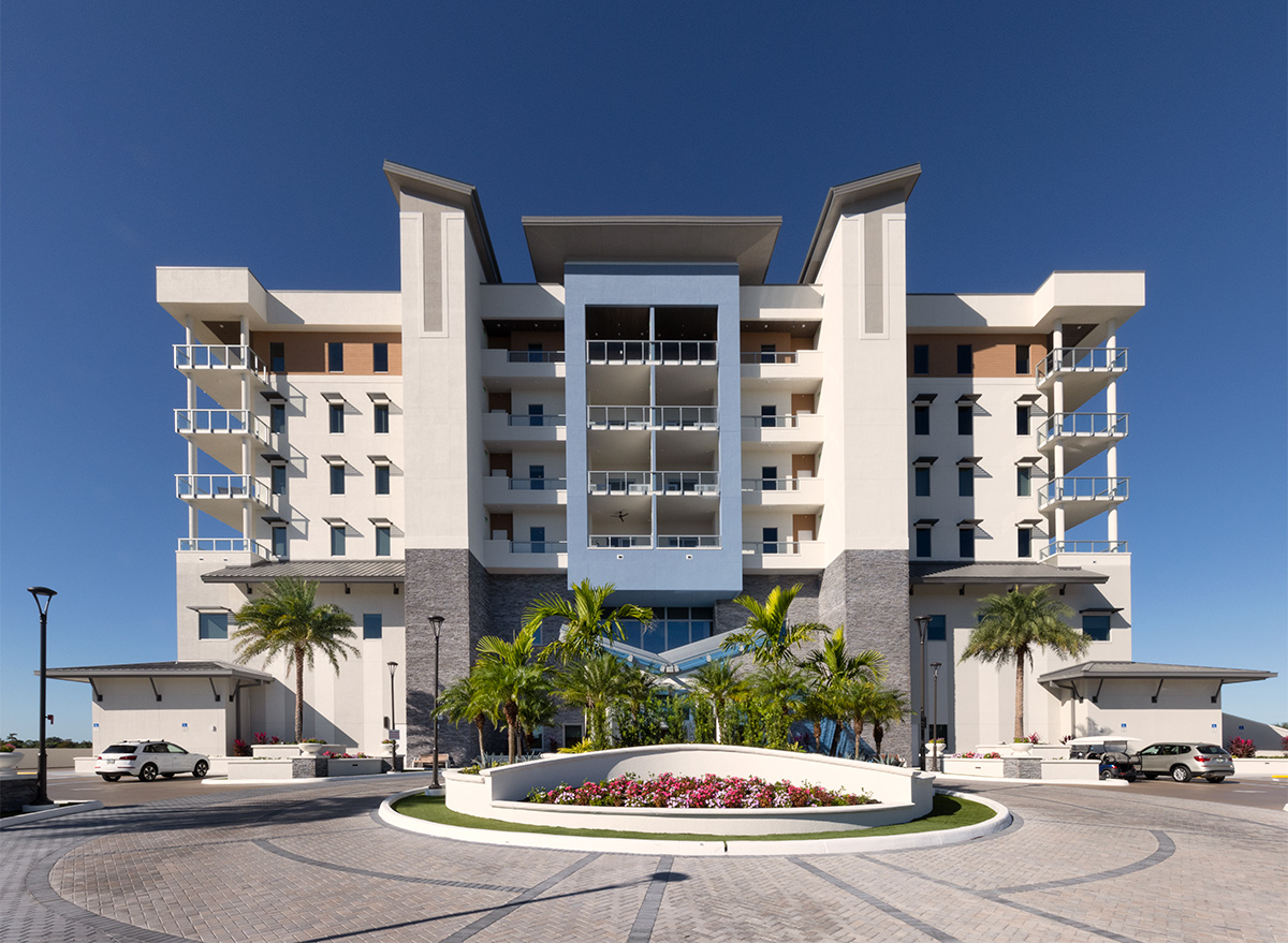 Architectural entrance view of Moorings Grand Lake Clubhouse in Naples, FL.