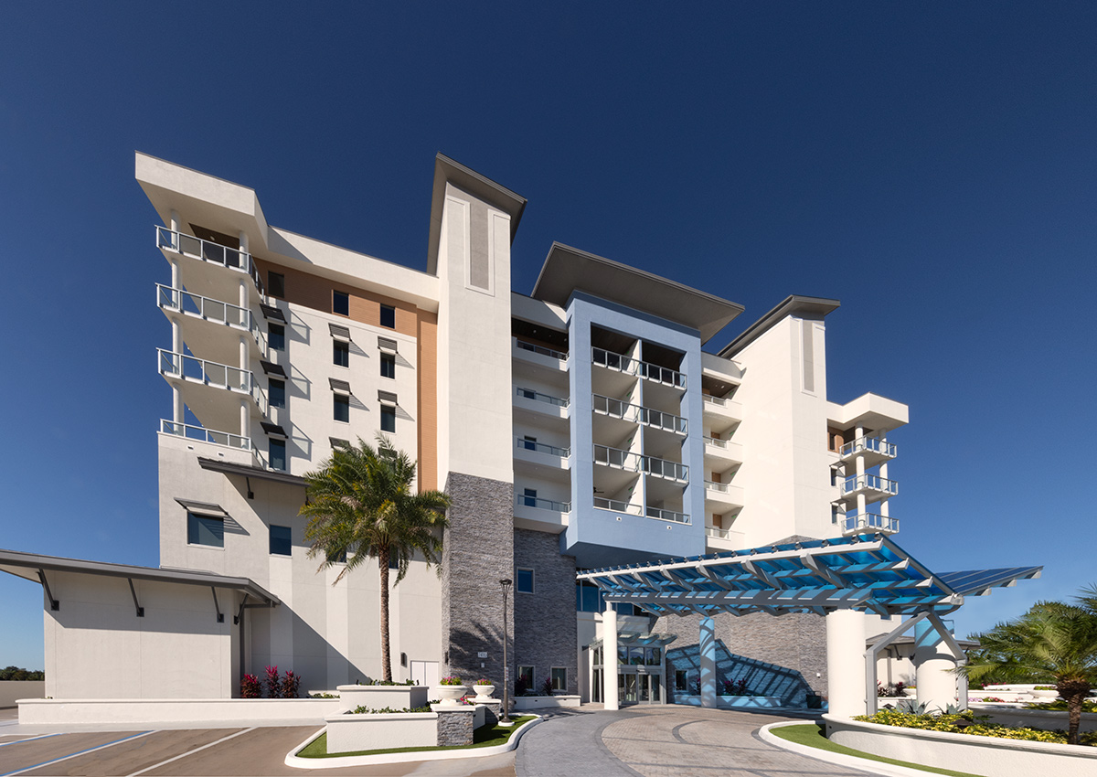 Architectural entrance view of Moorings Grand Lake Clubhouse in Naples, FL.