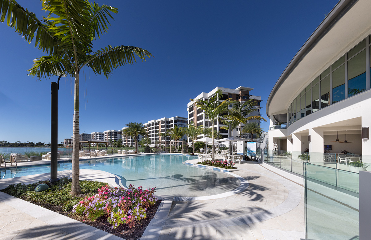 Architectural poolside view of Moorings Grand Lake Clubhouse - Naples, FL.