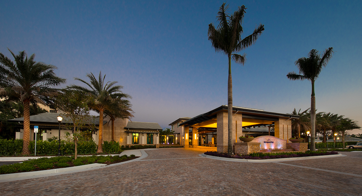 Architectural dusk view of Moorings Park Clubhouse in Naples, FL