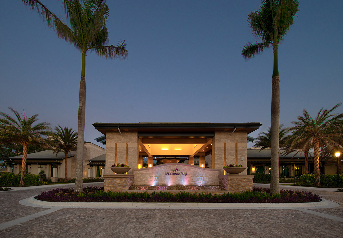 Architectural dusk view of Moorings Park Clubhouse in Naples, FL