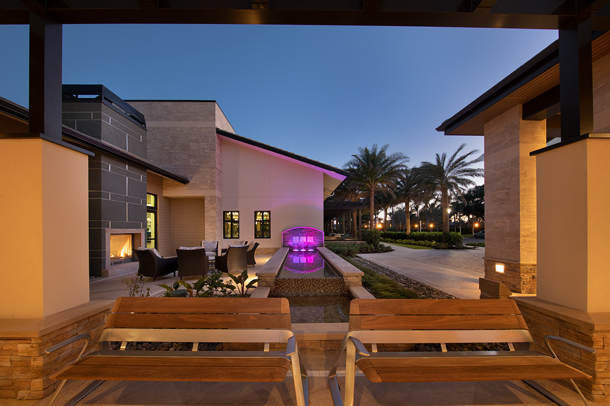 Architectural dusk view of Moorings Park Clubhouse in Naples, FL