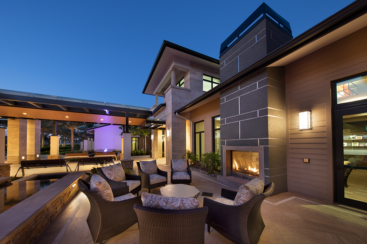 Architectural dusk view of Moorings Park Clubhouse in Naples, FL