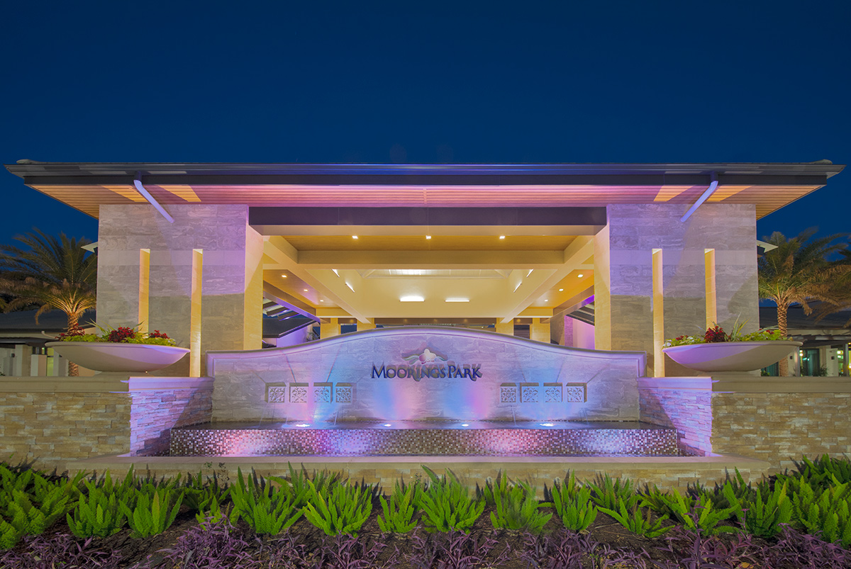 Architectural dusk view of Moorings Park Clubhouse fountain in Naples, FL