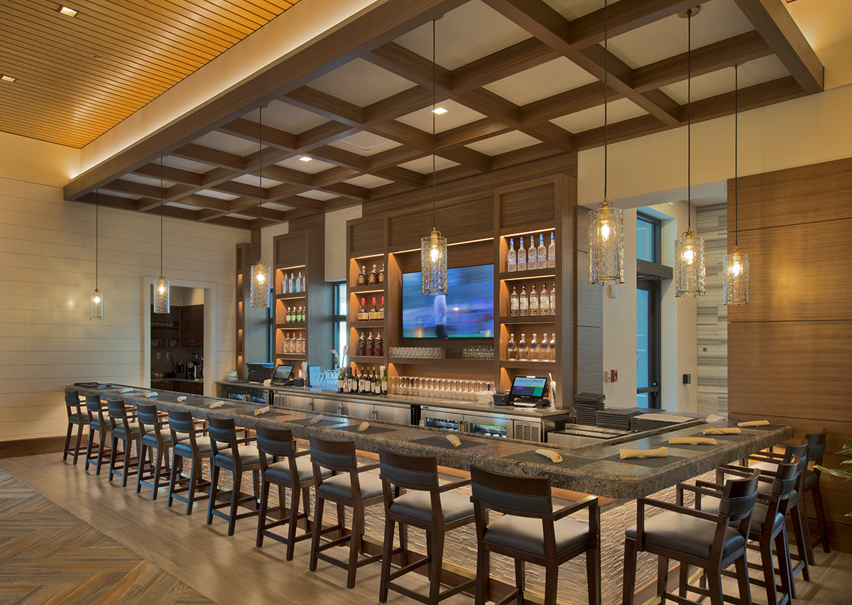 Interior design view of Moorings Park Clubhouse bar in Naples, FL.