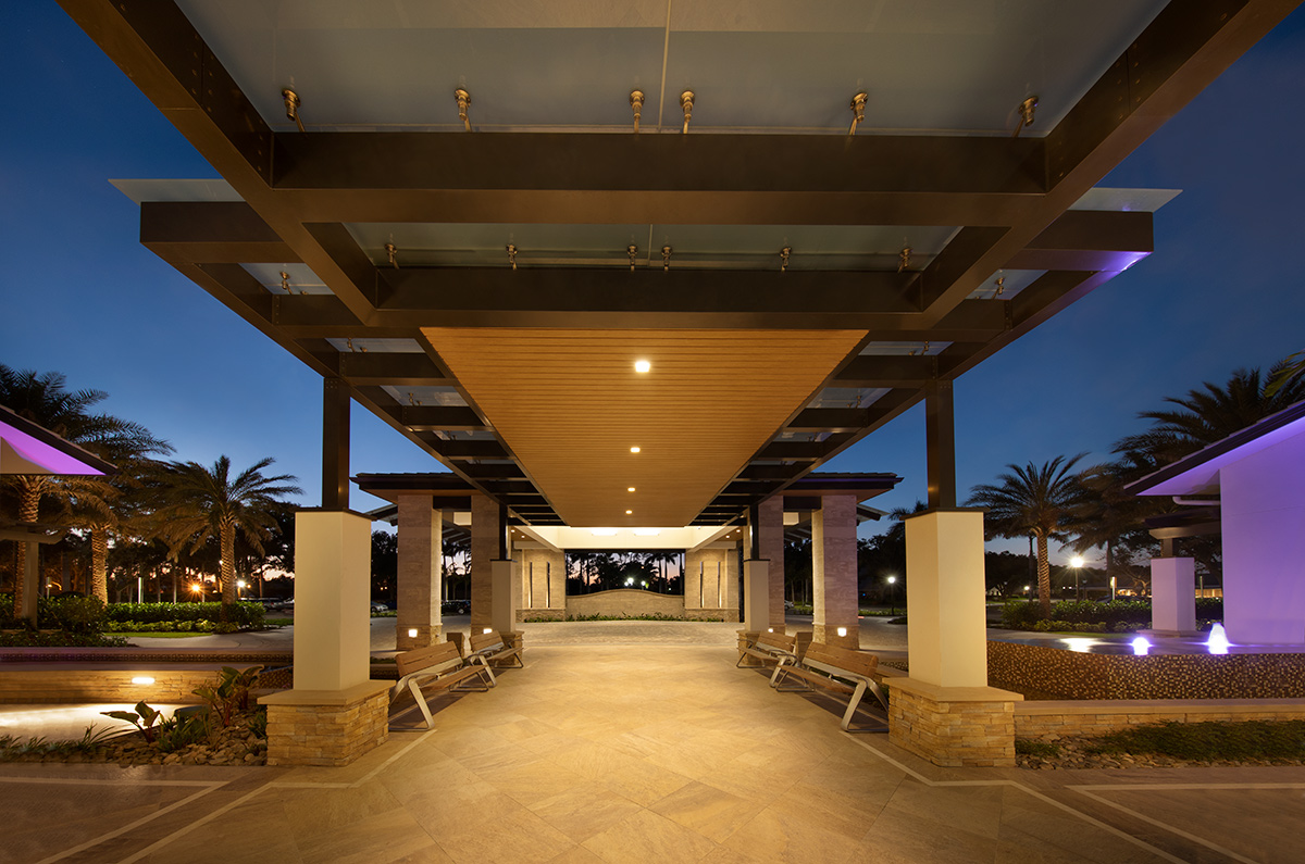 Architectural dusk view of Moorings Park Clubhouse in Naples, FL