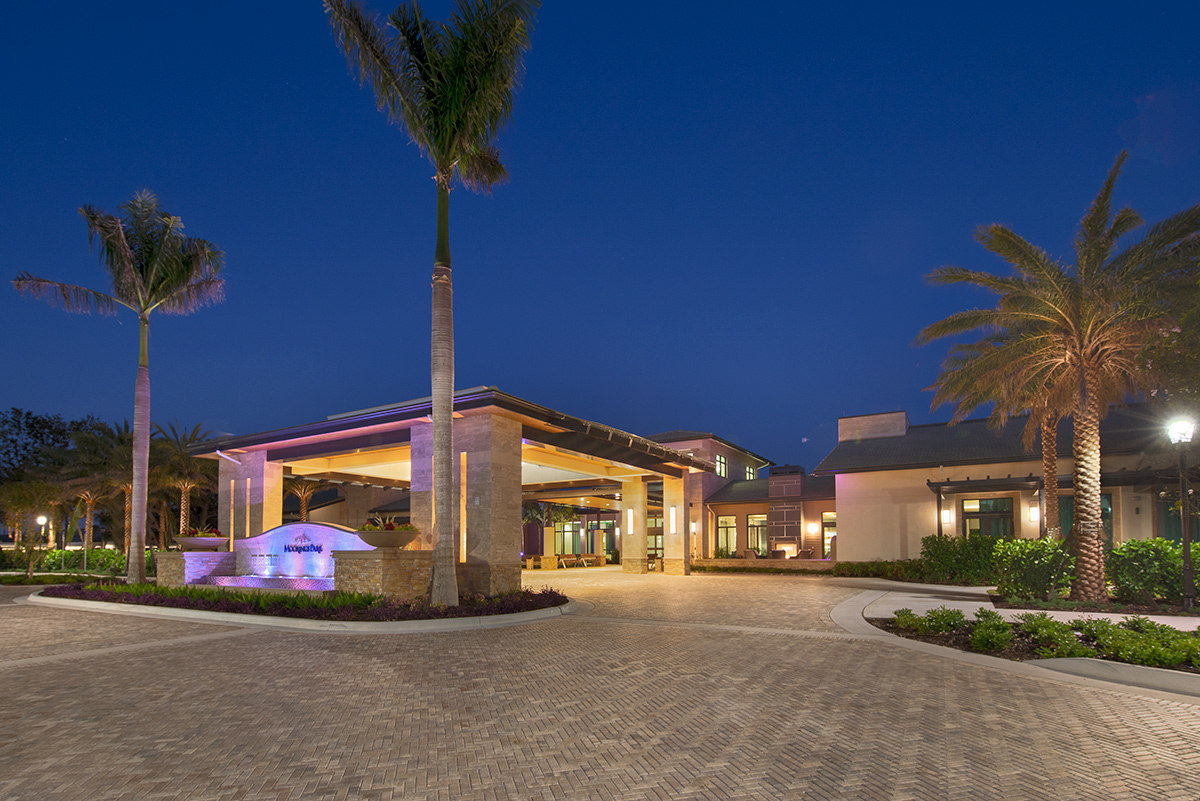 Architectural dusk view of Moorings Park Clubhouse in Naples, FL