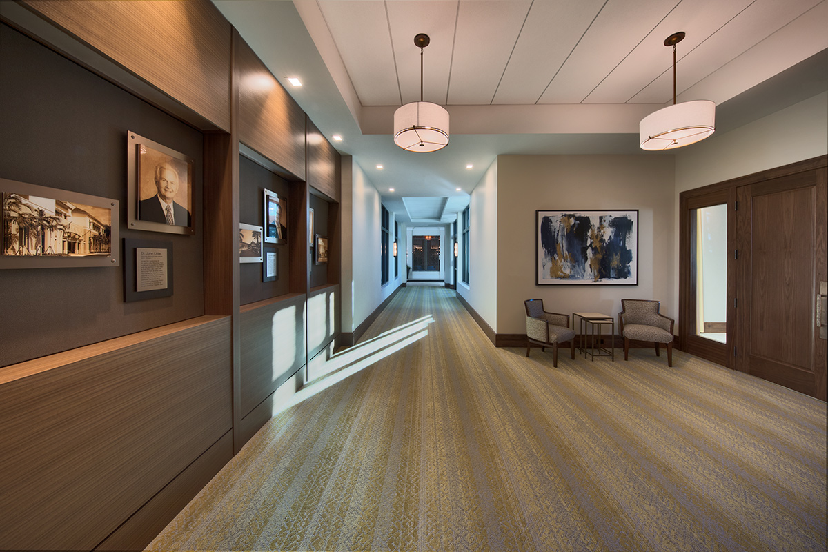 Architectural dusk view of Moorings Park Clubhouse corridor in Naples, FL