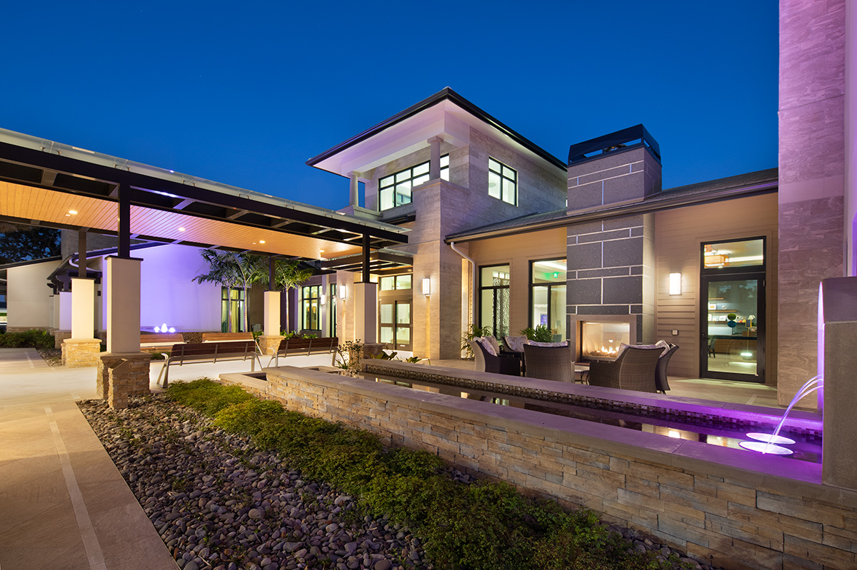 Architectural dusk view of Moorings Park Clubhouse fountain in Naples, FL