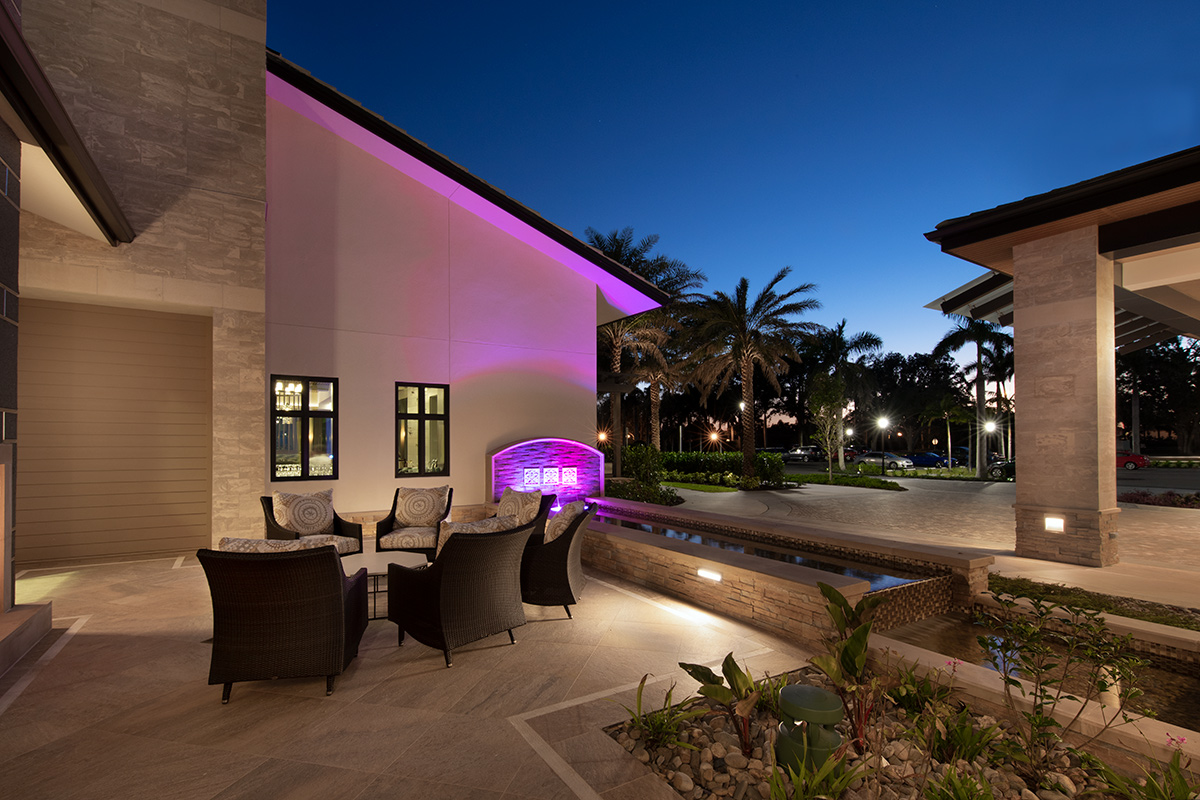 Architectural dusk view of Moorings Park Clubhouse fountain in Naples, FL