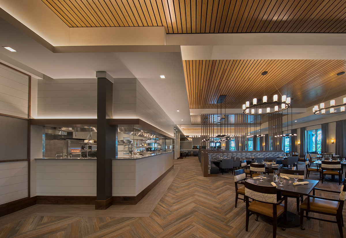 Interior design view of Moorings Park Clubhouse dining in Naples, FL.