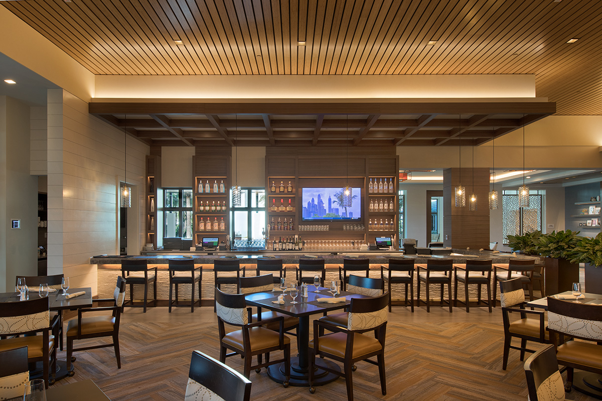 Interior design view of Moorings Park Clubhouse bar in Naples, FL.