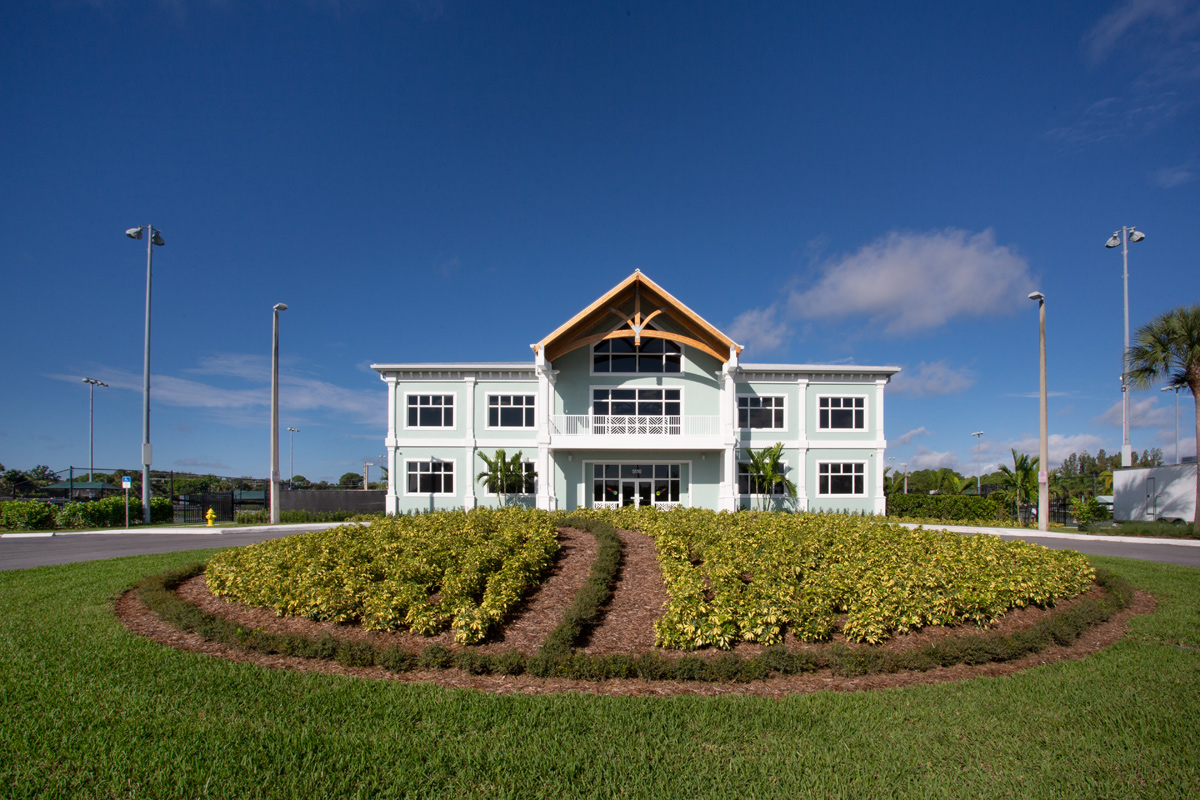 Architectural dusk view of the Palm Beach Gardens, FL tennis clubhouse.