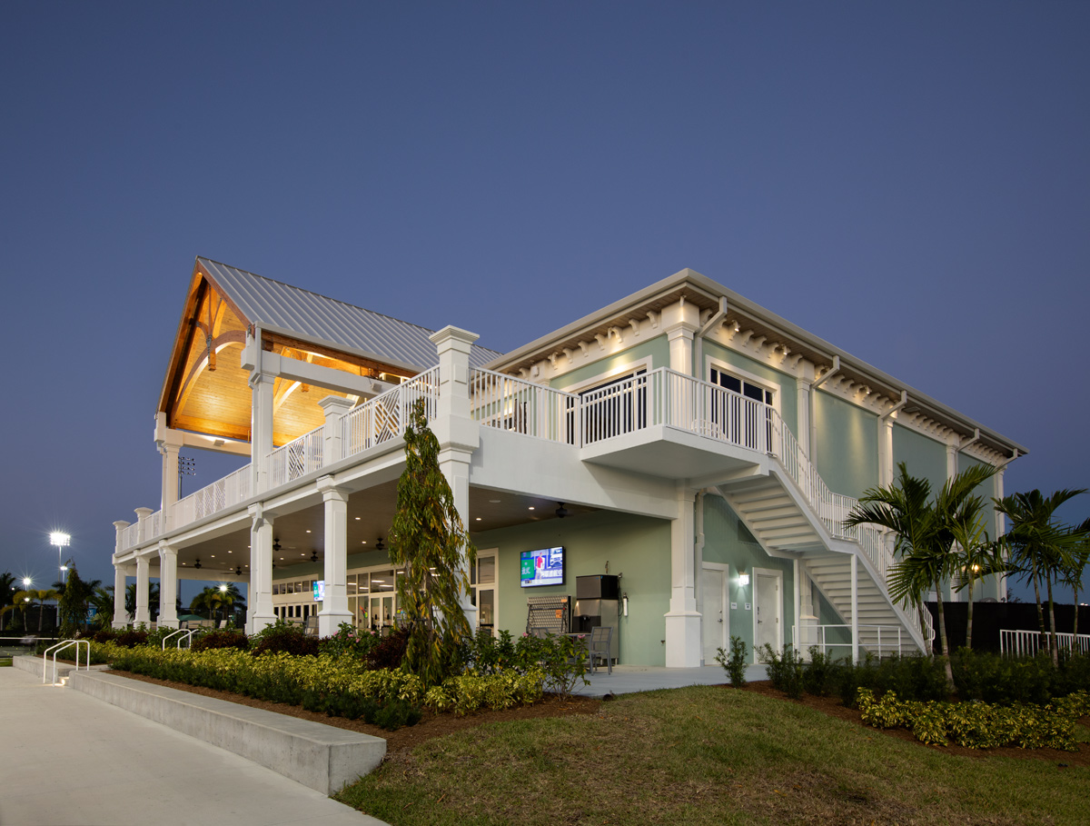 Architectural dusk view of the Palm Beach Gardens, FL tennis clubhouse.