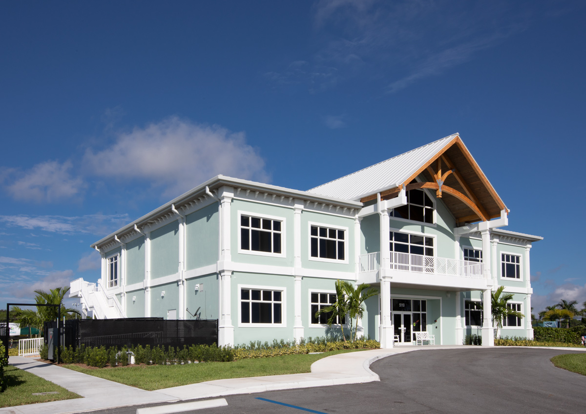 Architectural entrance view of the Palm Beach Gardens, FL tennis clubhouse.