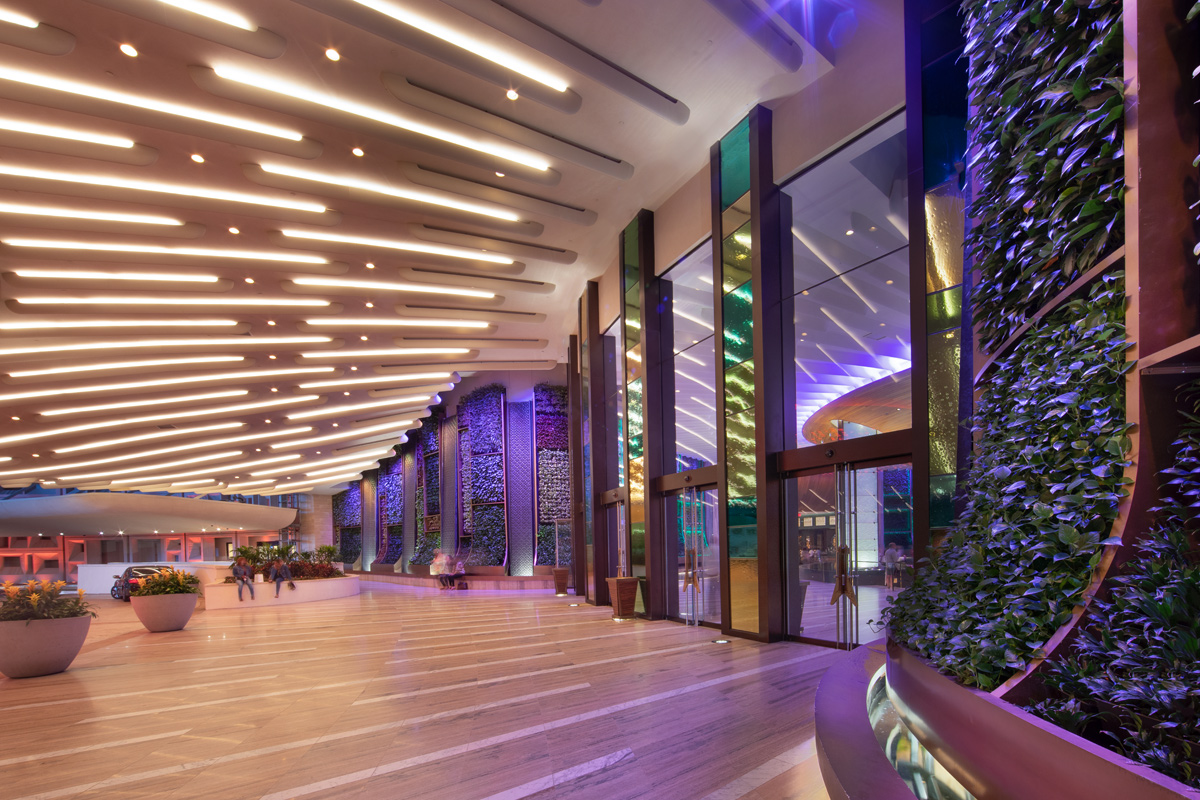 Architectural dusk view of the Hard Rock Hollywood guitar hotel entrance.