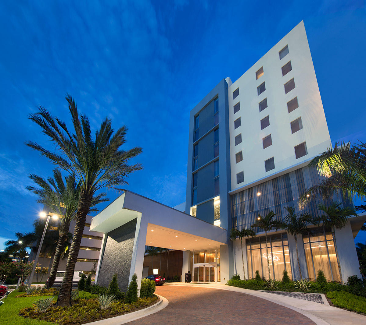 Architectural dusk view of the AC Hotel entrance Aventura, FL