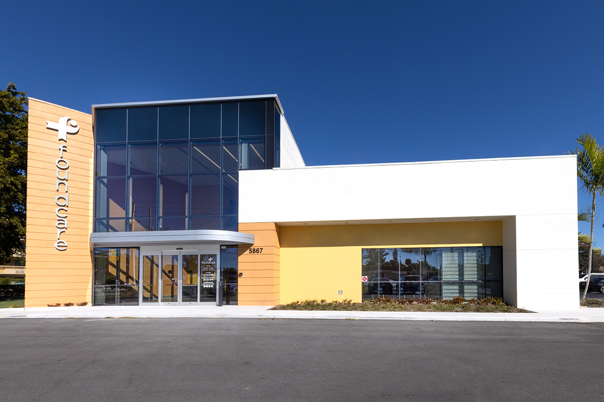 Architectural entrance view of the Foundcare clinic in West Palm Beach, FL.