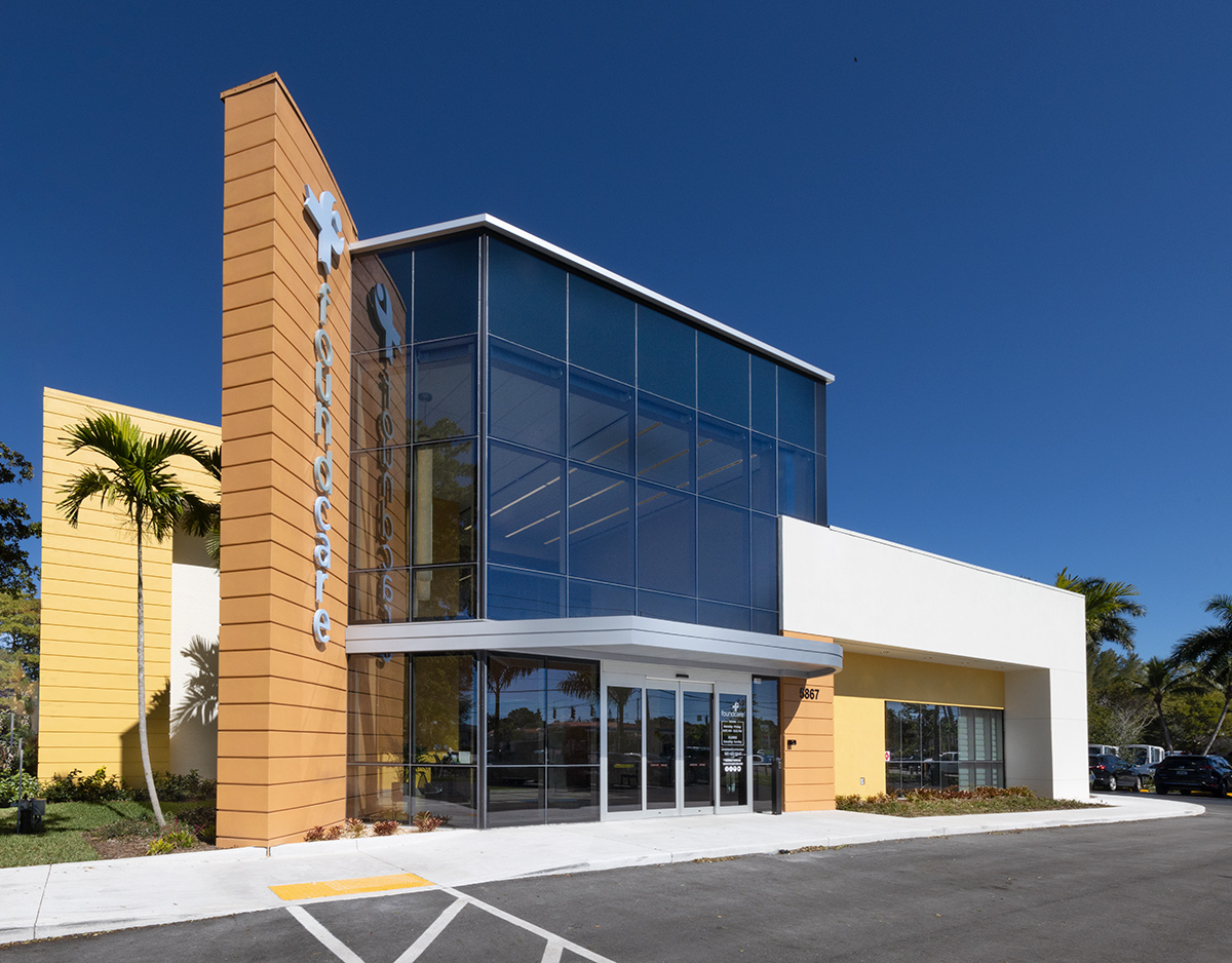 Architectural entrance view of the Foundcare clinic in West Palm Beach, FL.