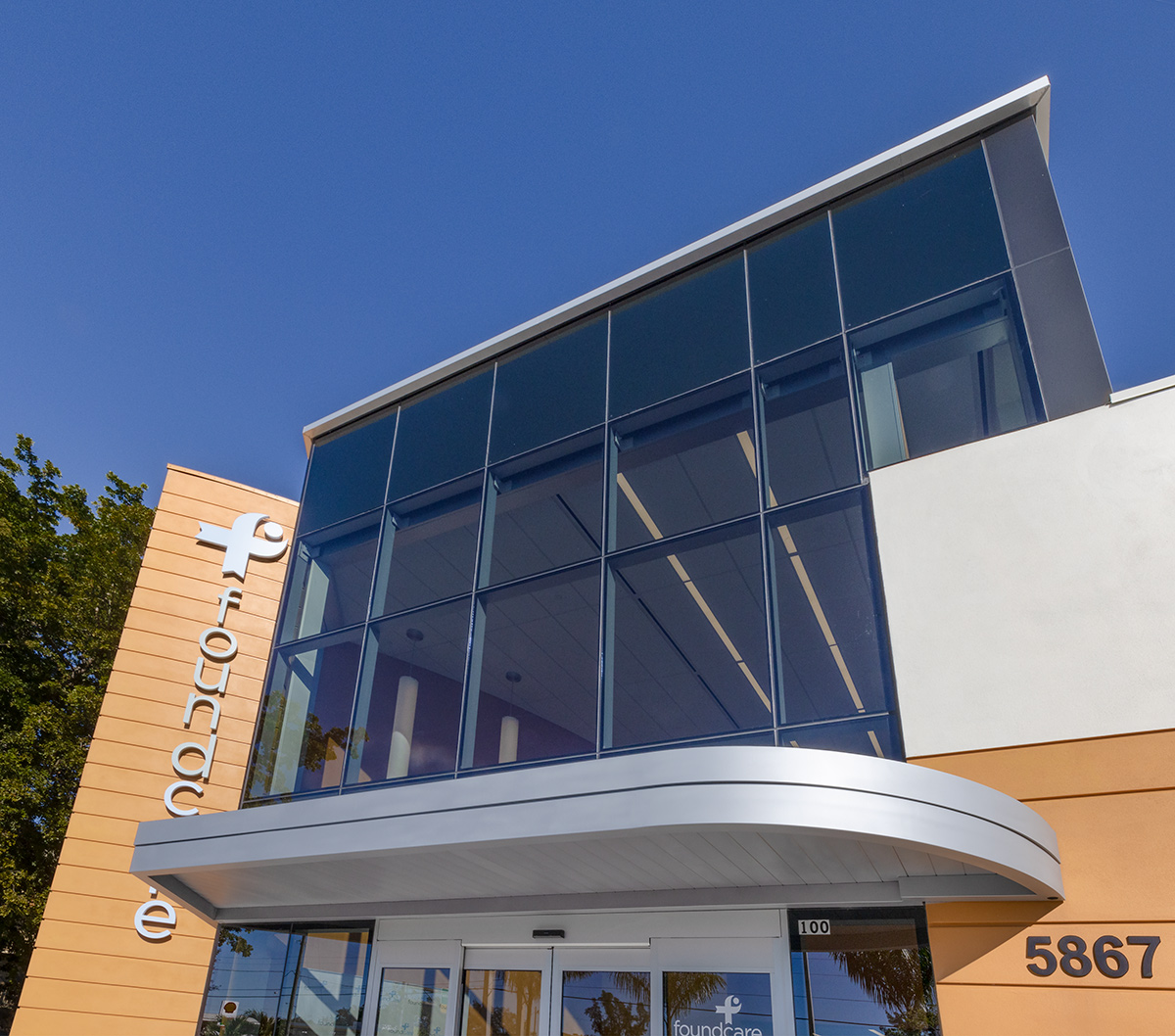 Architectural entrance view of the Foundcare clinic in West Palm Beach, FL.