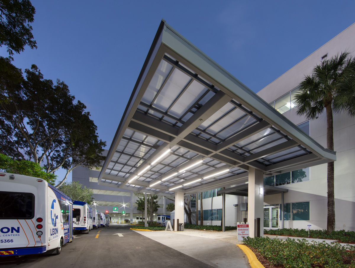 Architectural dusk view of the Leon Medical Center emergency entrance in Kendall, FL