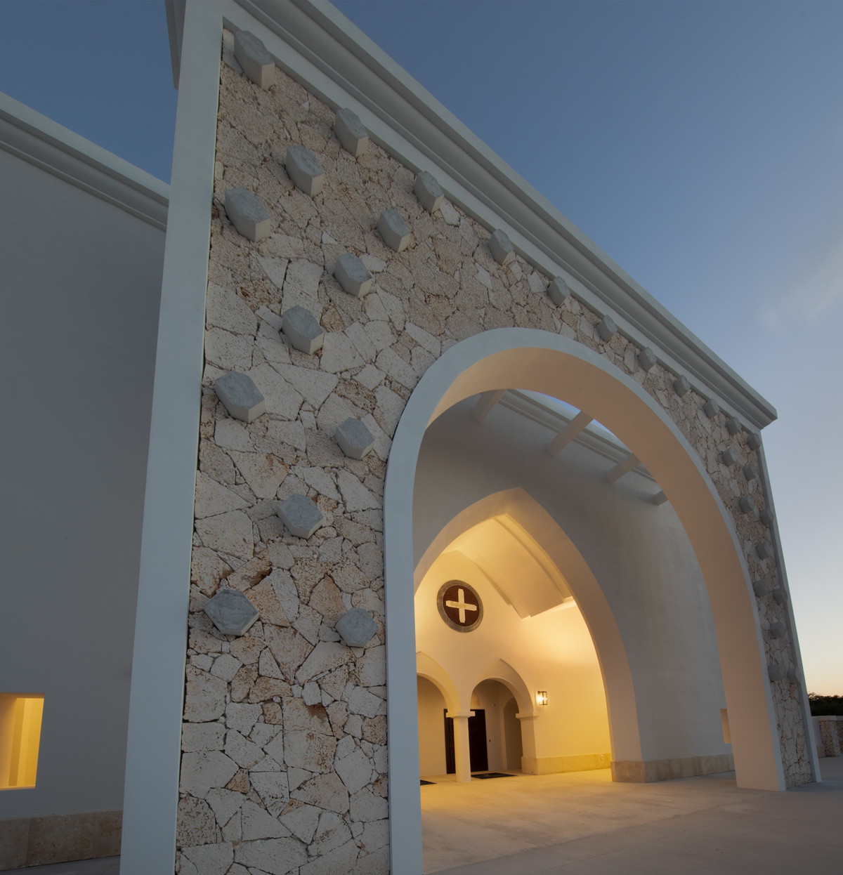 Architectural dusk detail view of the Palmer Trinity school chapel entrance in Miami, FL