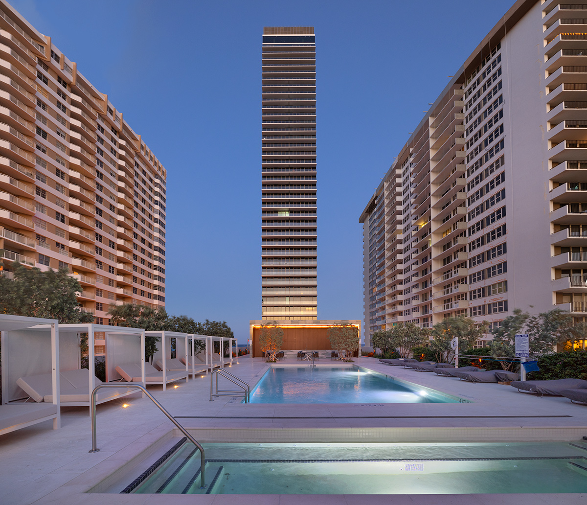 Architectural dusk pool deck views at the 2000 Ocean condo in Hallandale Beach, FL.