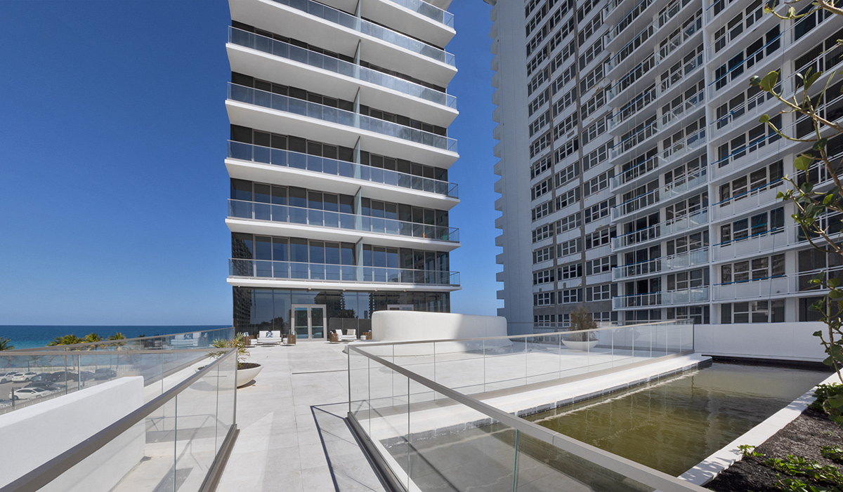 Architectural pool deck entry views of the 2000 Ocean condo in Hallandale Beach, FL.