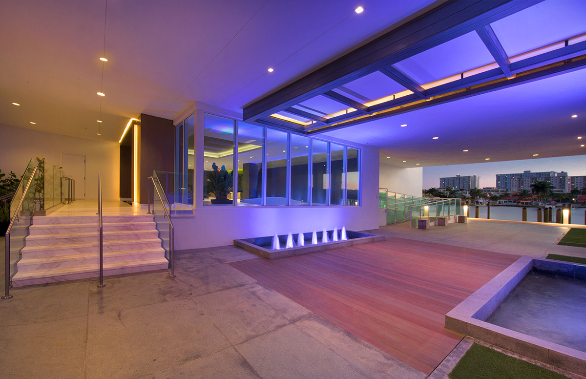 Architectiural dusk view of the entrance at the 400 Sunny Isles condo.