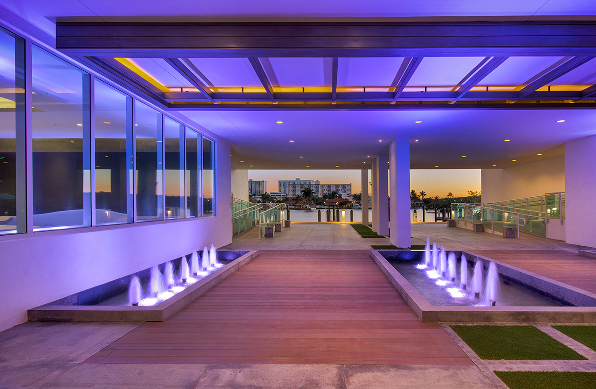 Architectiural dusk view of the entrance at the 400 Sunny Isles condo.