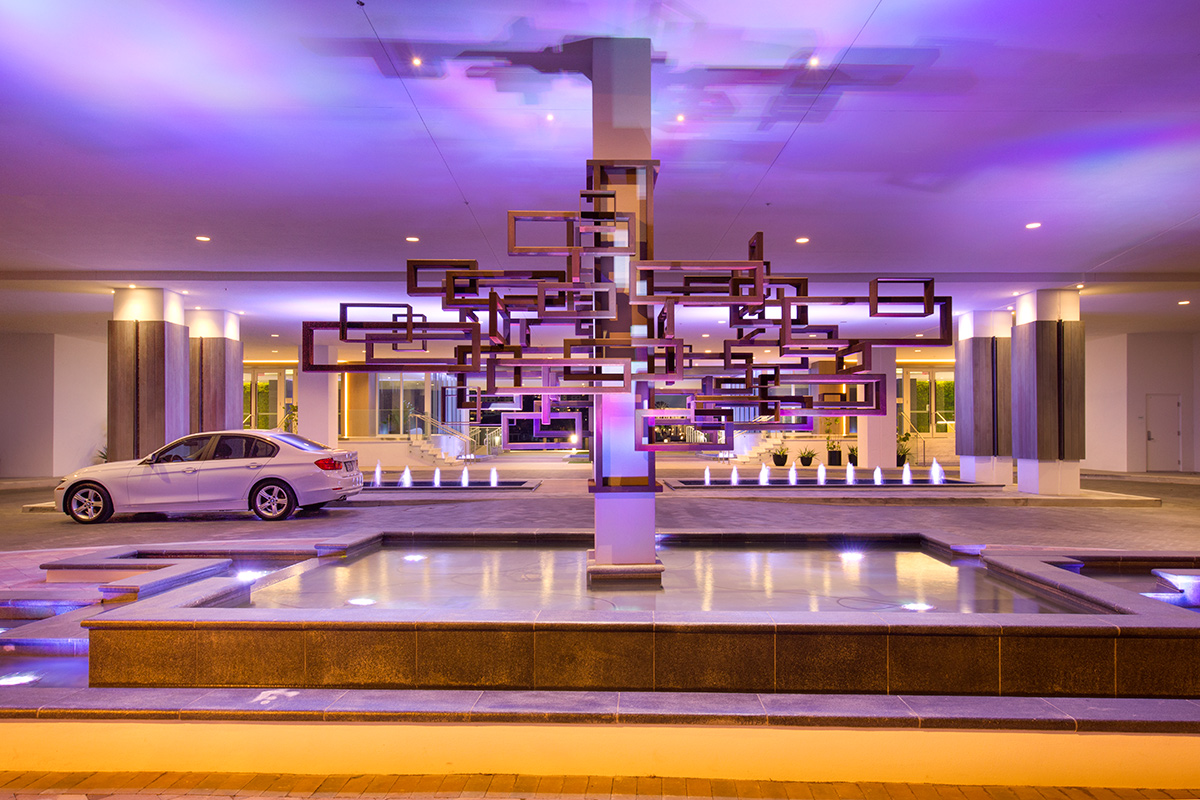 Architectiural dusk view of the entrance at the 400 Sunny Isles condo.