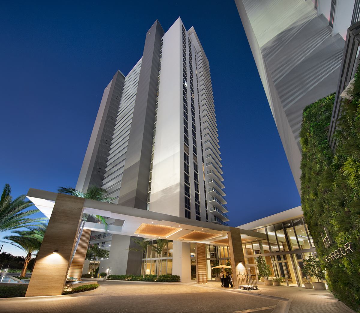 Architectural dusk view of the Harbour Condo Tower N Miami Beach, FL