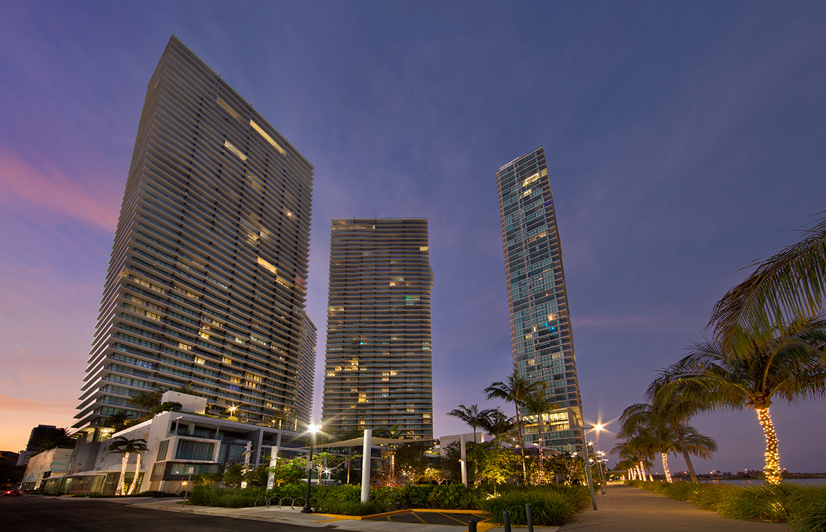 Paraiso Bay condo towers Miami architectural dusk view.