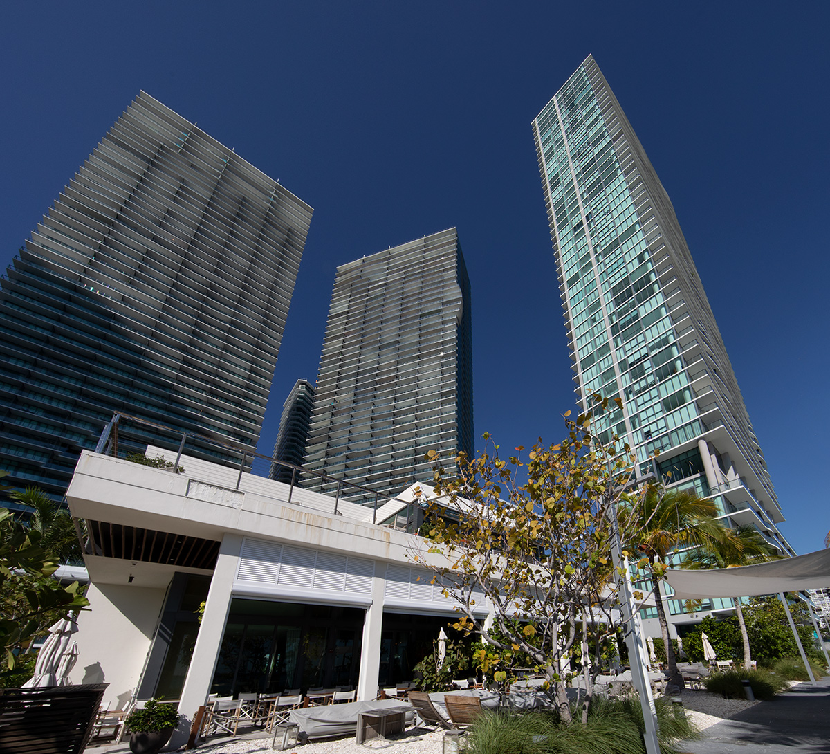 Paraiso Bay condo towers Miami architectural and restaurant view.