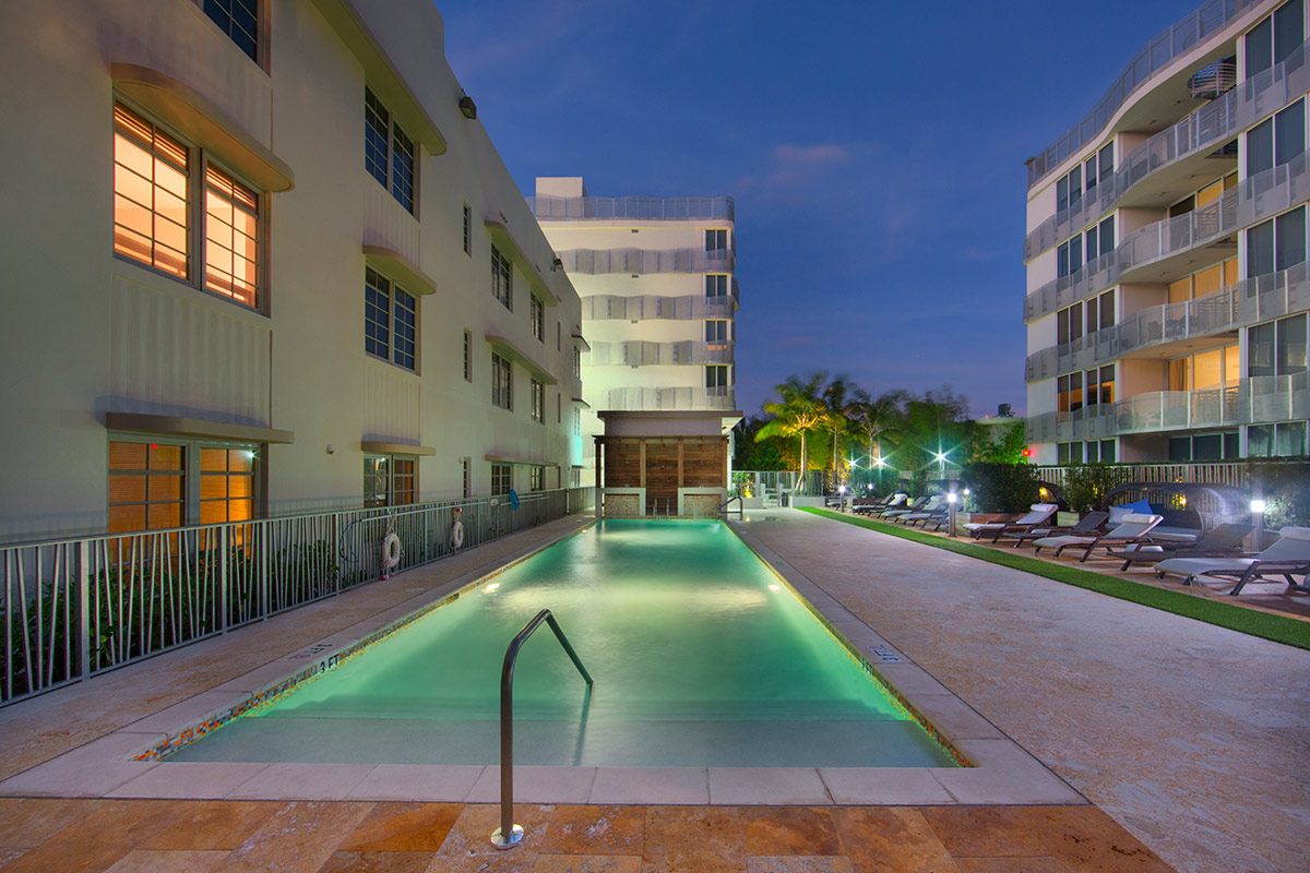 Architectural pool dusk view at Artecity Luxury Condos - Miami Beach, FL