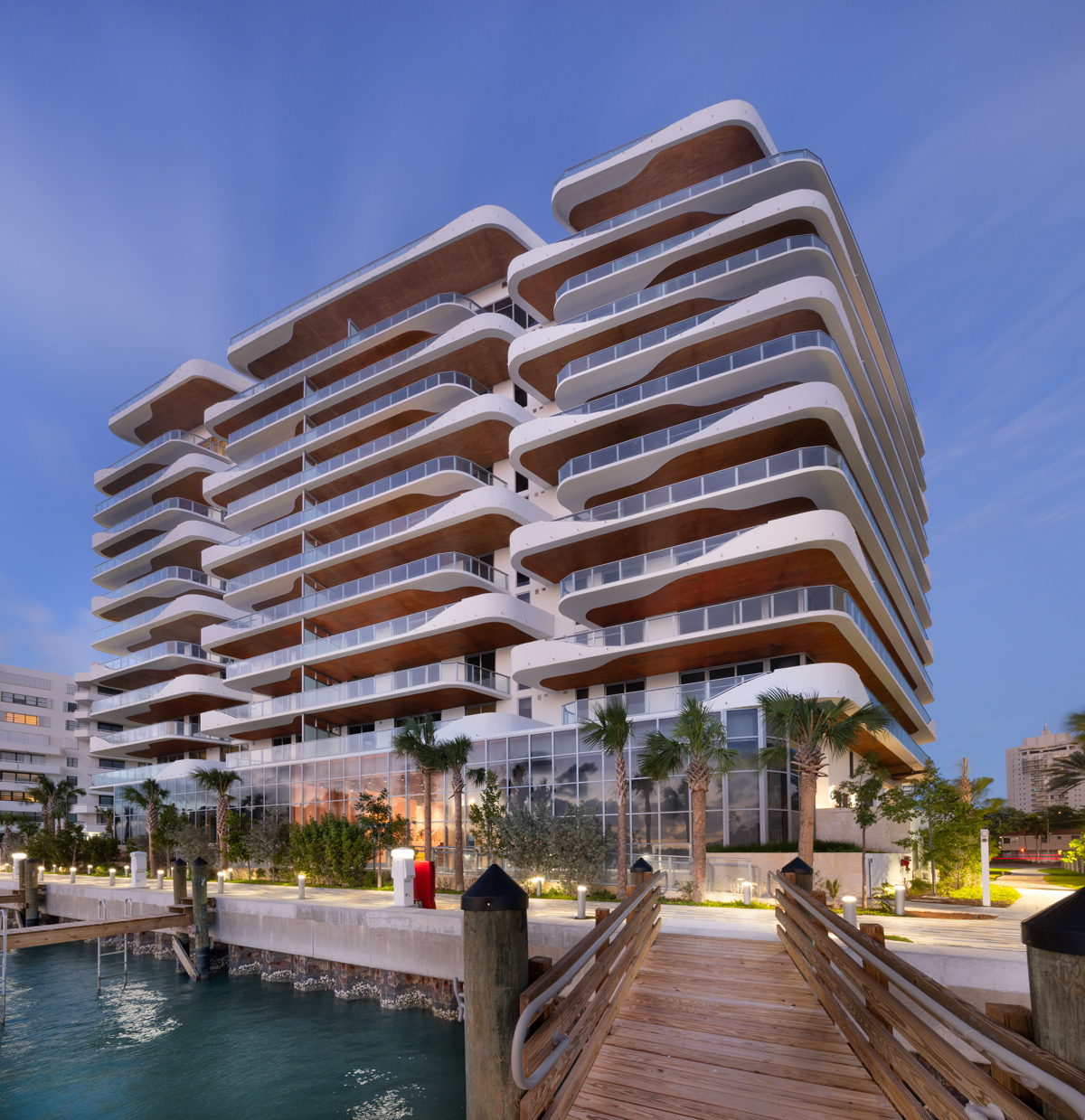 Architectural dusk view of Monaco Yacht Club condo in Miami Beach, FL.