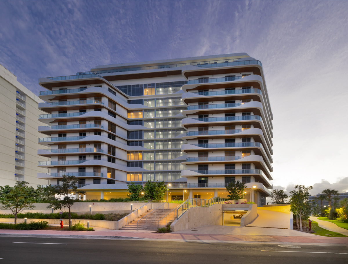 Architectural dusk view of Monaco Yacht Club condo in Miami Beach, FL.