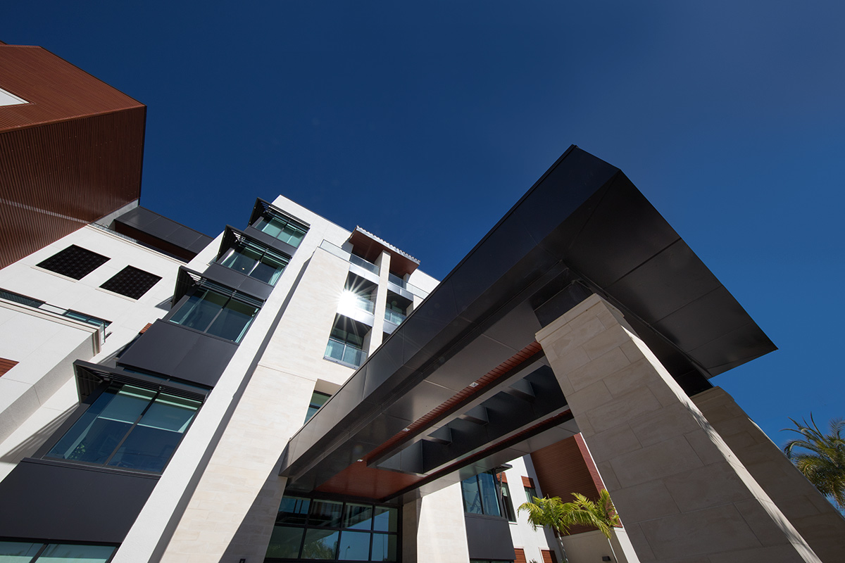 Architectural view of Moorings Park at Grey Oaks senior living in Naples, FL.