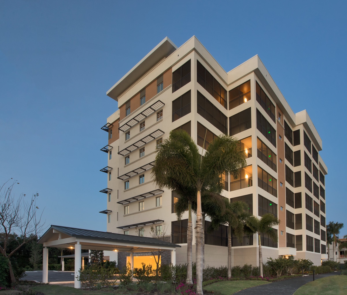 Architectural dusk view of Moorings Park Grande Lake Senior Living in Naples, FL