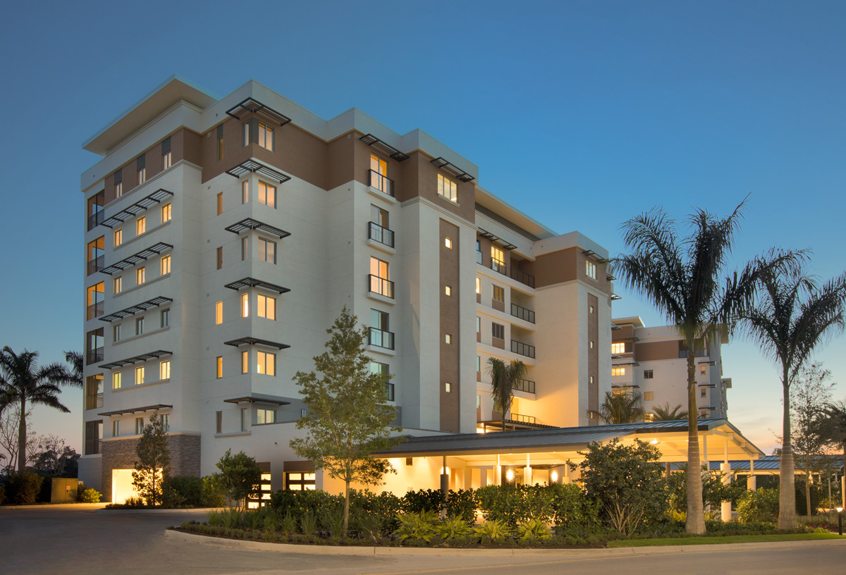 Architectural dusk view of Moorings Park Grande Lake Senior Living in Naples, FL