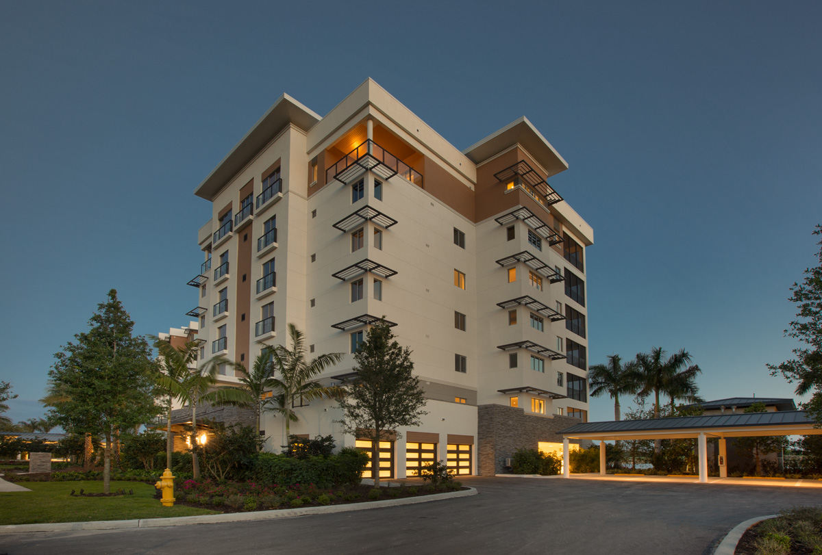 Architectural dusk view of Moorings Park Grande Lake Senior Living in Naples, FL