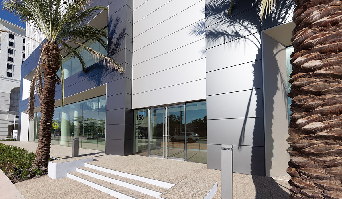 Architectural entrance view of the Miami Jaguar - Land Rover dealership.