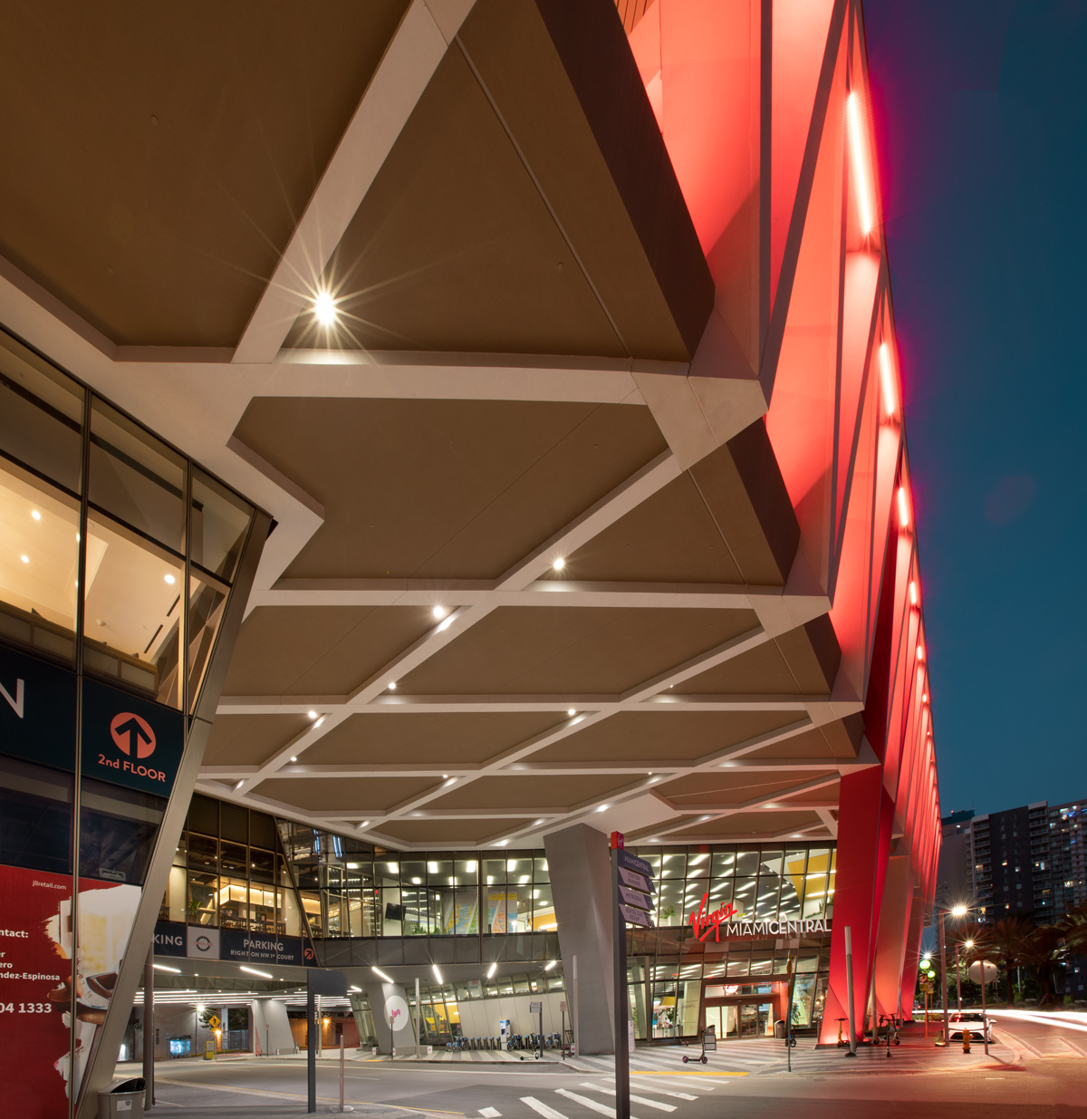 Architectural dusk view of the Brightline Miami Central terminal  entrance.