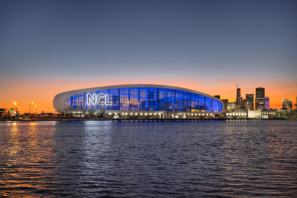 Architectural dusk water view of the Norwegian Cruise Lines Terminal B Port Miami.